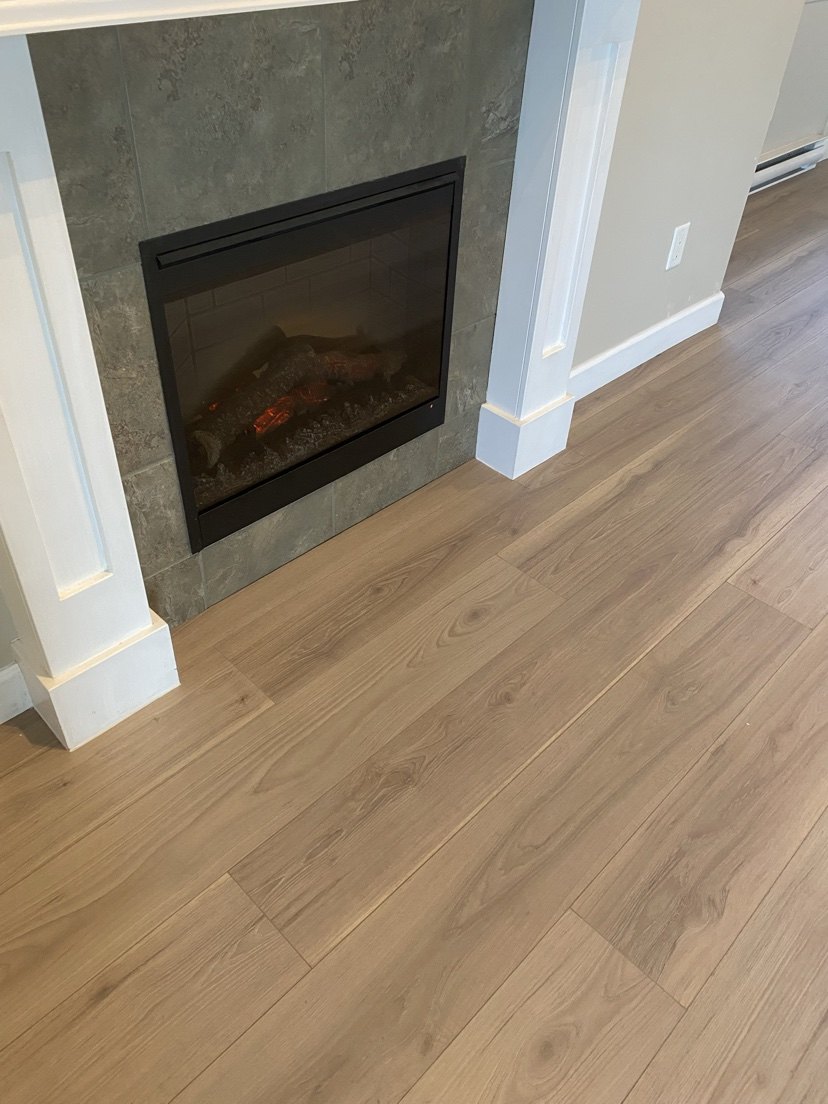 Living room with light wood-look plank flooring